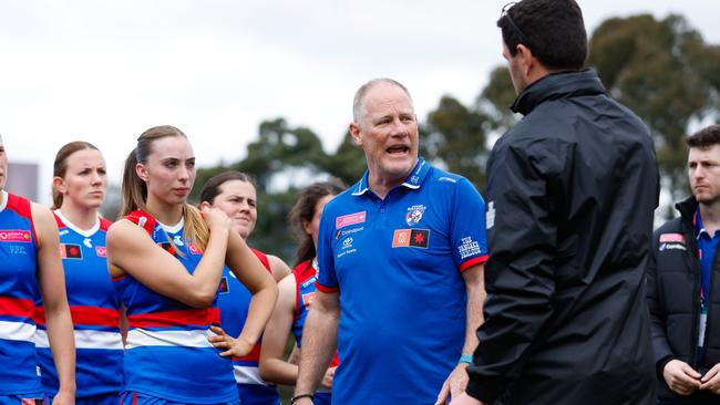 MELBOURNE, AUSTRALIA - AUGUST 19: Nathan Burke, Senior Coach of the Western Bulldogs addresses his players during the 2023 AFLW practice match between the Western Bulldogs and the North Melbourne Kangaroos at Arden Street on August 19, 2023 in Melbourne, Australia. (Photo by Dylan Burns/AFL Photos via Getty Images)