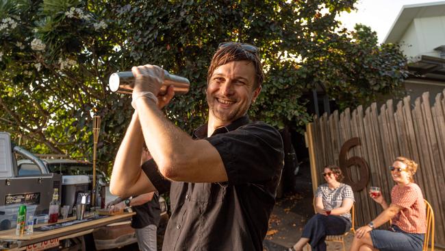 <span id="U701237519414y5D" style="letter-spacing:-0.015em;">Dominic Wundke serving drinks to Martha Tattersall and Vanessa Wright out the front of their house in Rapid Creek. Picture: Che Chorley</span>