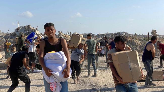 The aid distribution began normally but later went awry. Picture: AFP)