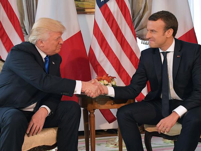 US President Donald Trump (L) called French President Emmanuel Macron (R) before the announcement to tell him of the decision. Picture: AFP