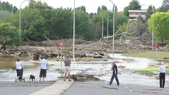 Queanbeyan was split in two by the worst flooding in 30 years as the town's main shopping precinct became submerged beneath muddy flood waters. Picture: Kym Smith