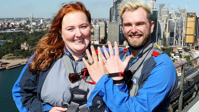 Sam Forbutt and Dan Stevens after getting married at the top of the Sydney Harbour Bridge. Picture: Tim Hunter