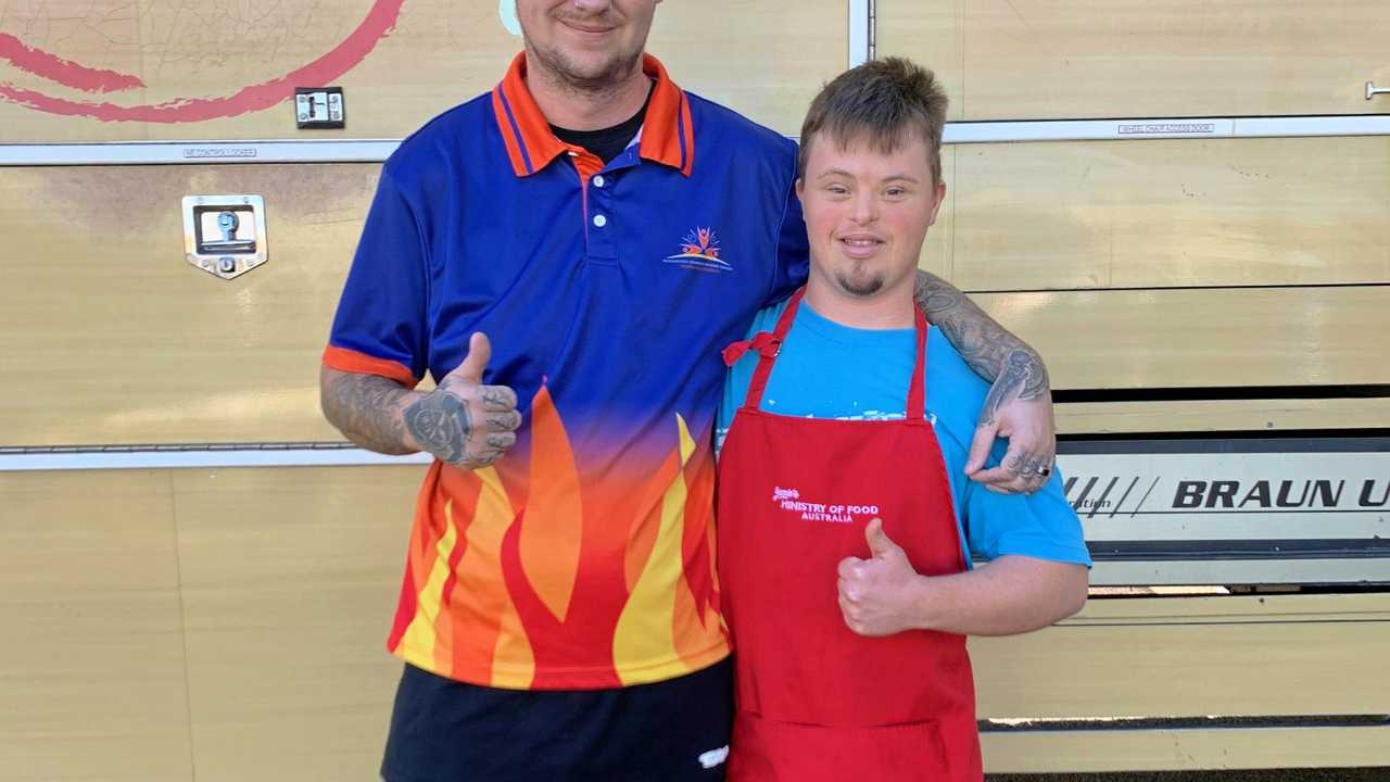 Tarron George in his Jamie Oliver apron with John Hellmuth. Picture: Rhylea Millar