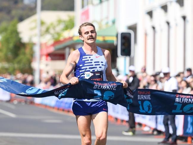 Jack Rayner runs through the victory tape at the Burnie 10 on Sunday. Picture: Supplied