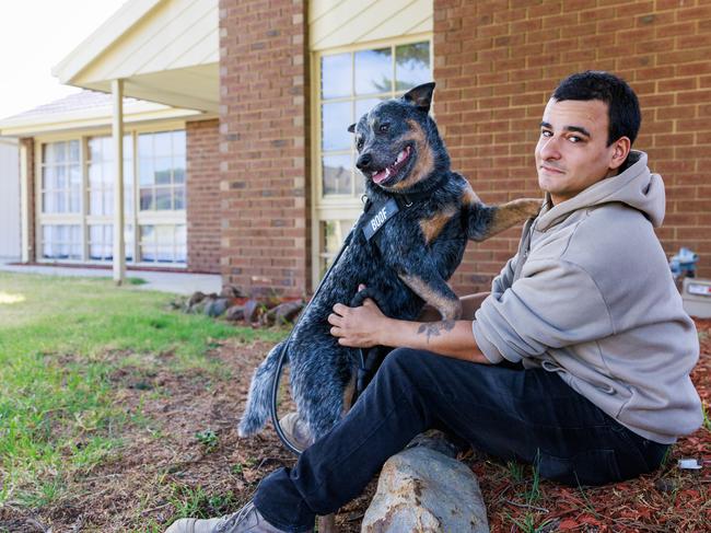 1/03/2024 Matthew Calleja pictured with his dog Boof at his home in Craigieburn. He bought his first home on the final auction weekend of 2023 and moved into it earlier this year. And after a three-year house hunt he's thrilled he was able to tap into the Victorian Homebuyer Fund as well as a stamp duty waiver to make his home dream a reality. Not the least because it's given him and blue heeler Boof their own space. Aaron Francis / Herald Sun