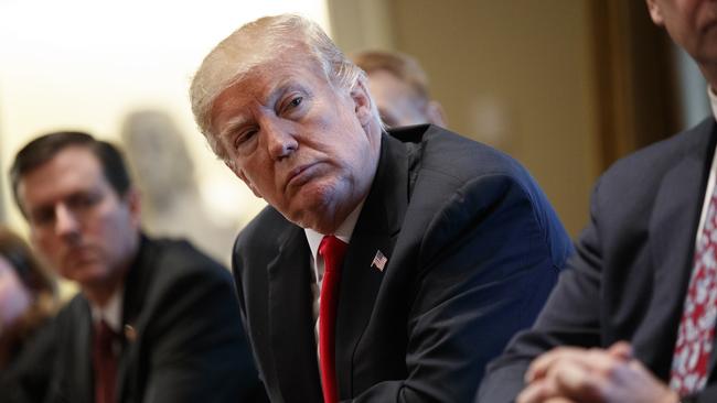 President Donald Trump listens during a meeting with steel and aluminum executives in the Cabinet Room of the White House, Thursday, March 1, 2018, in Washington. Trump's announcement that he will impose stiff tariffs on imported steel and aluminum has upended political alliances on Capitol Hill. (AP Photo/Evan Vucci)