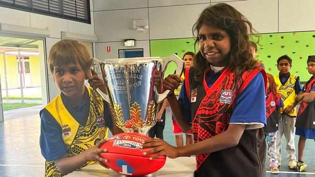 Sadadeen Primary School students with the AFL premiership cup in Alice Springs, September, 2024.