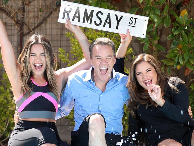 Neighbours was about to be axed by Network 10, but a Uk network have bought the rights for the next 3 years, saving the tv show. Actors Olympia Valance [as Paige], Stefan Dennis [as Paul], and  Rebekah Elmaloglou [as Therese], celebrate by the pool.  Picture: Alex Coppel.