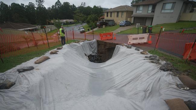 A giant sinkhole has opened up in a street in Coffs Harbour Picture: Twitter/Jake Lapham