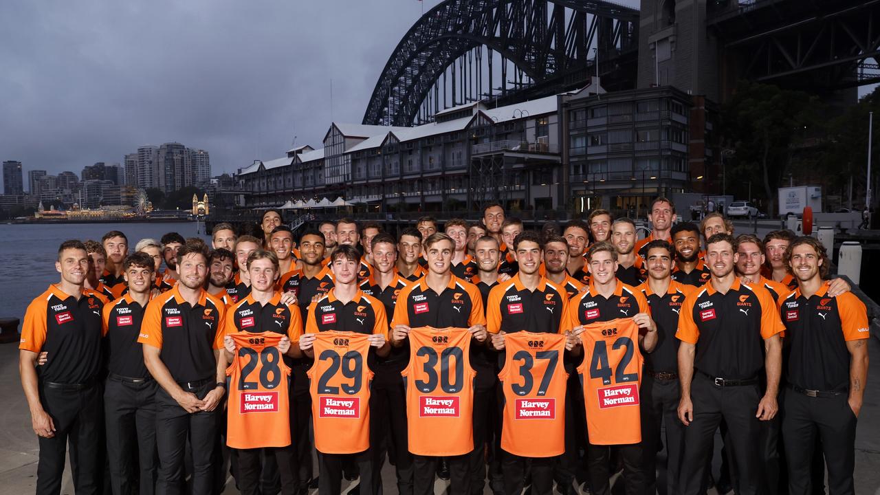 The Giants draftees with their new jumpers and the full squad. Picture: Phil Hillyard