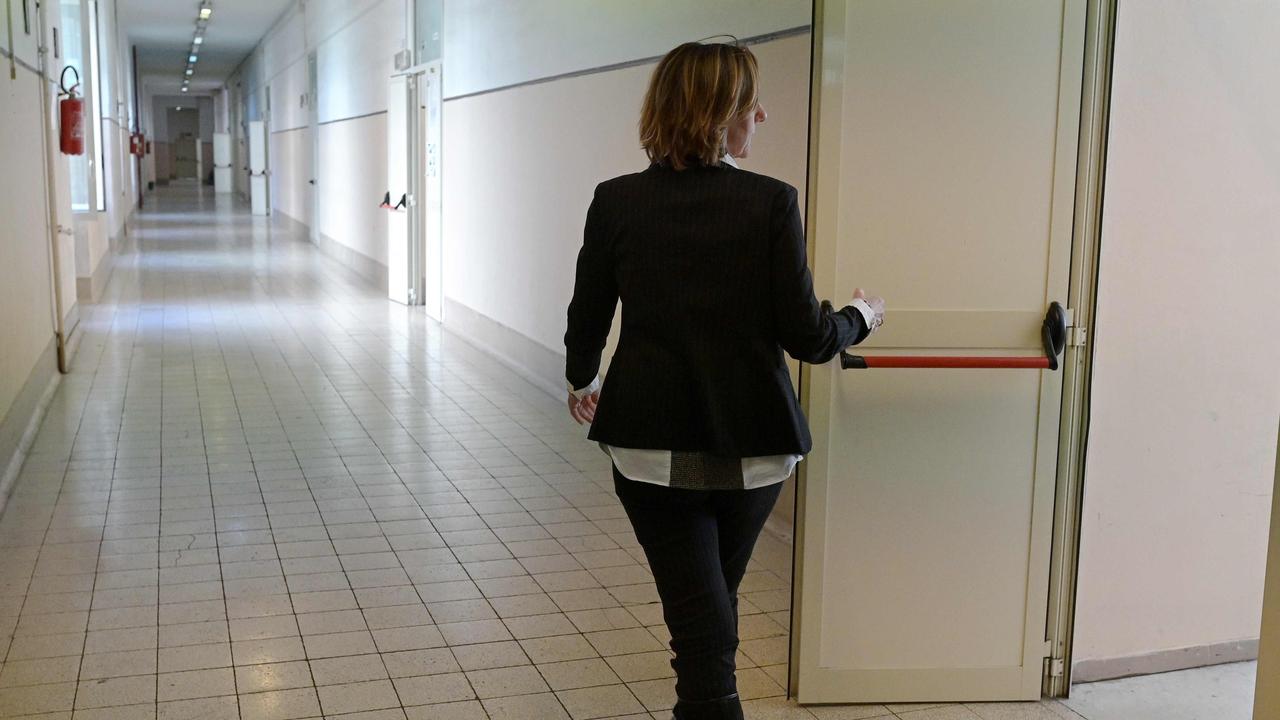 A headmaster walks through an empty school in Italy. Picture: Vincenzo Pinto / AFP