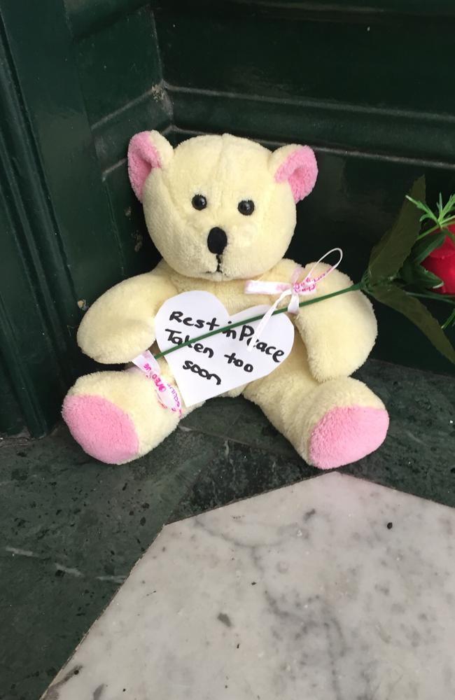 A tribute teddy bear left outside the building where Ms Dunn’s body was found.