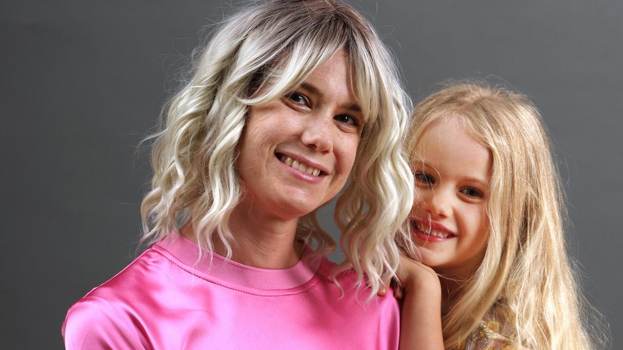 Redland Bay mum Louise Bennett, with daughter Evie, is showing off her mastectomy scar to help other women undergoing treatment. Picture: Annette Dew