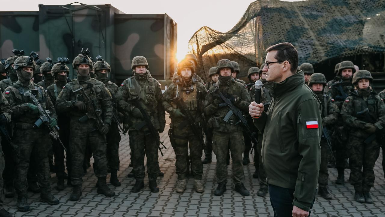 Polish Prime Minister Mateusz Morawiecki speaks to border army units at the Belarusian-Polish border as migrants gather on the border on November 9, 2021 in Kuznica Bialostocka, Poland. Picture: Polish Defence Ministry via Getty Images