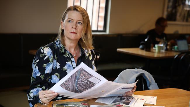 Larissa Penn, pictured reading planning documents for the Beaches Link.