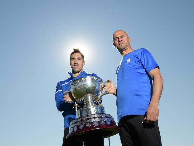 Alejandro Sanchez and coach Abbas Saad with the NPL trophy at their Belmore ground. Picture: Simon Bullard