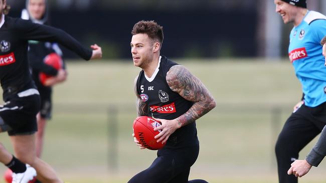 Jamie Elliott runs with the ball during a training session at Holden Centre in July. Picture: Getty Images