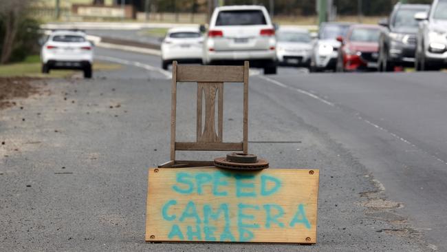 A handpainted warning sign for a mobile speed camera parked on Camden Valley Way. Picture: Jonathan Ng