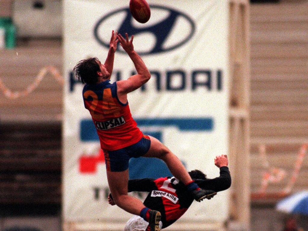 Trent Cummings flies for a mark against Essendon in 1996.