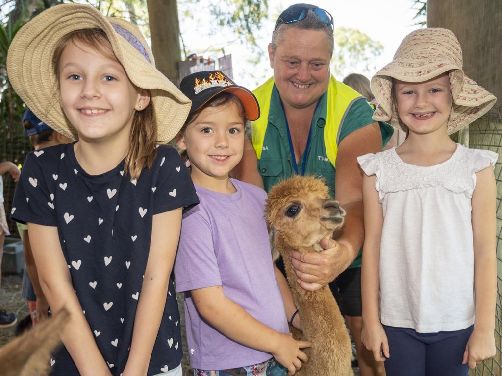 (from left) Imogen Hinrichsen, Alyssa Hinrichsen, Alissa Maher and Lily Porter enjoy Viv's Farm Animals at the Toowoomba Royal Show. Friday, March 25, 2022. Picture: Nev Madsen.