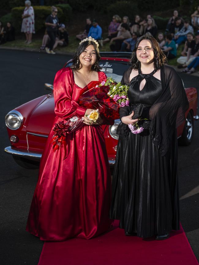 Phimkae Nielsen (left) and Lisa Williams arrive at Harristown State High School formal at Highfields Cultural Centre, Friday, November 18, 2022. Picture: Kevin Farmer