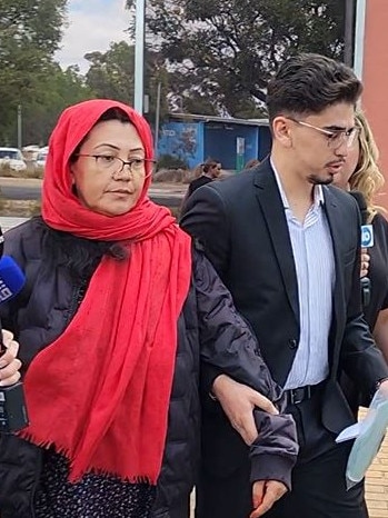 Ms Qamber leaves court with a supporter on Thursday. Picture: Leah Smith