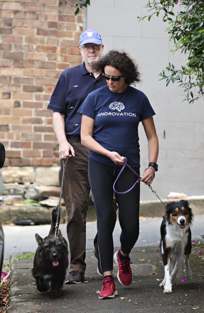 Former ABC chairman Justin Milne and his wife walk their dogs on Tuesday. Picture: Adam Yip