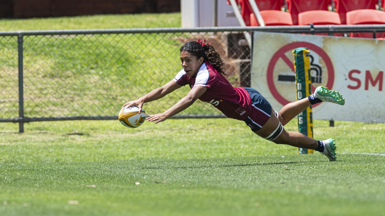 Fleur Ginn gets a Queensland Reds try as Downs Rugby host Next Gen 7s at Toowoomba Sports Ground, Saturday, October 12, 2024. Picture: Kevin Farmer