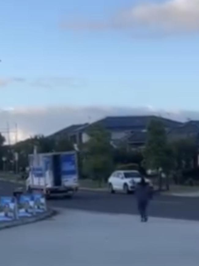 The video, shared to Facebook, shows a truck emblazoned with election material for Greenway Liberal candidate Rattan Virk pulling out of a driveway with the back doors open. Picture: Facebook.