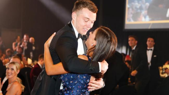 Cripps embraces his partner Monique Fontana after winning a thrilling Brownlow Medal. Photo: Michael Wilson.