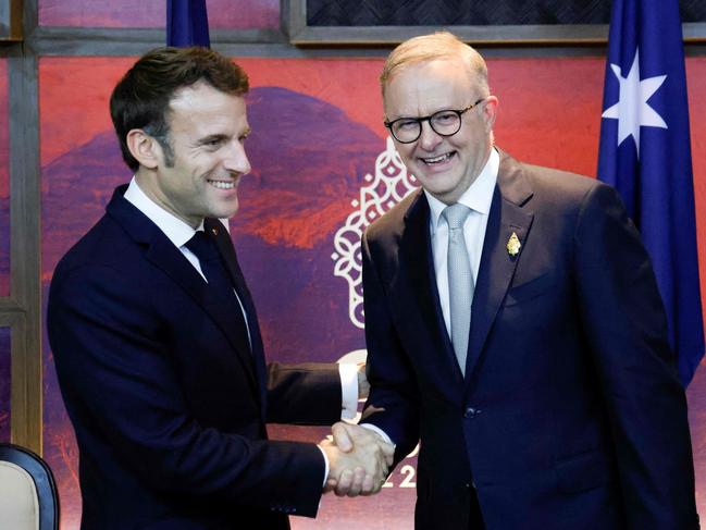 France's President Emmanuel Macron (L) meets Australia's Prime Minister Anthony Albanese on the sidelines of the G20 Summit in Nusa Dua on the Indonesian resort island of Bali on November 16, 2022. (Photo by Ludovic MARIN / POOL / AFP)