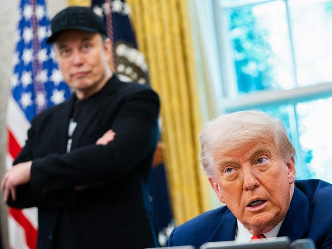US President Donald Trump speaks during a news conference with Elon Musk (L) in the Oval Office of the White House in Washington, DC, on May 30, 2025. Musk, who stormed into US politics as President Trump's chainsaw-brandishing sidekick, announced on May 28 that he is leaving his role in US government, intended to reduce federal spending, shortly after his first major break with the President over Trump's signature spending bill. (Photo by Allison ROBBERT / AFP)