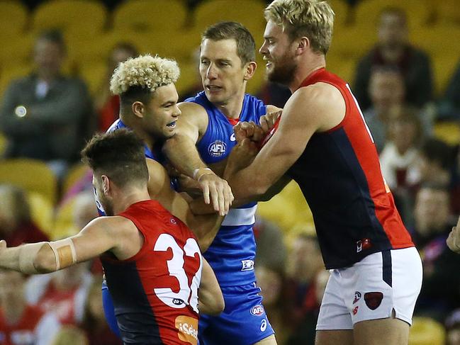 AFL : Round 13 : Western Bulldogs vs. Melbourne at Etihad Stadium, 18th June, , Melbourne Australia.  Melbourne's Jack Watts gets into Western Bulldogs Jason Johannisen, with Western Bulldogs Dale Morris and Melbourne's Tomas BuggPicture : George Salpigtidis