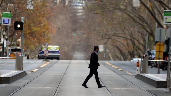 A normally bustling Collins Street, in Melbourne’s CBD, is now virtually empty. Picture: Alex Coppel.