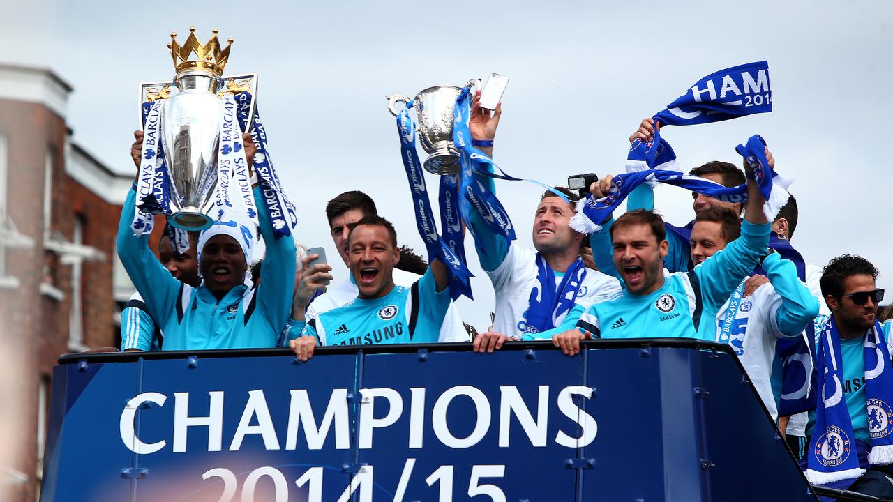 LONDON, ENGLAND - MAY 25: Didier Drogba and John Terry hold up the Premier League trophy and League Cup trophy as they exit the stadium during the Chelsea FC Premier League Victory Parade on May 25, 2015 in London, England, (Photo by Charlie Crowhurst/Getty Images)