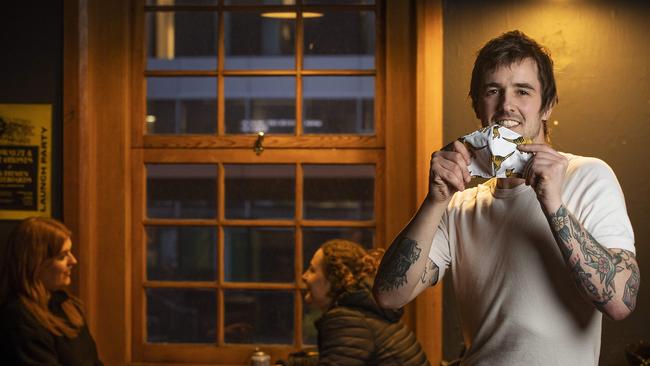 Grinners owner Ben Wells sports a face mask from Lily and Dot, Hobart. Picture Chris Kidd