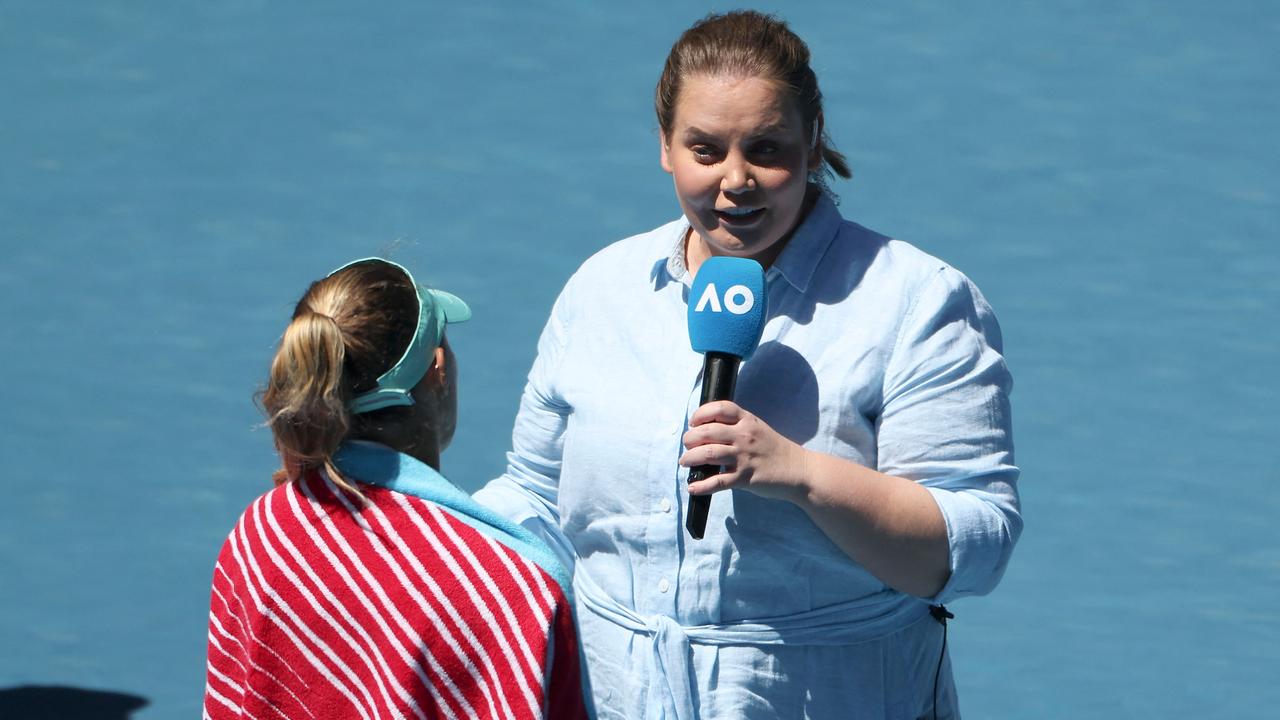 Dokic talks to Poland's Magda Linette in her commentary role at the 2023 Australian Open. (Photo by Martin KEEP / AFP)