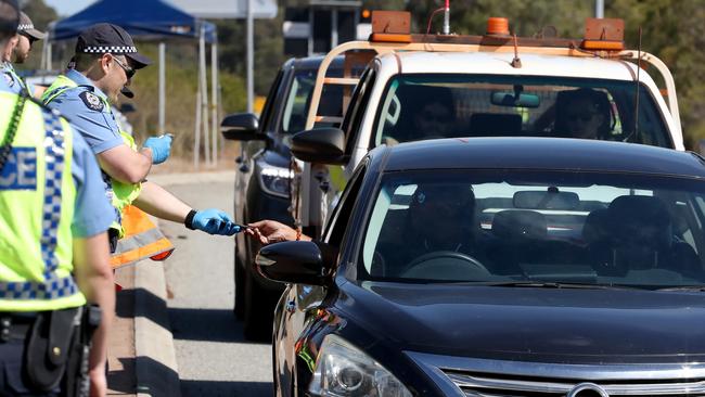 Police at checkpoints on the Albany Highway outside Perth. Picture: Colin Murty