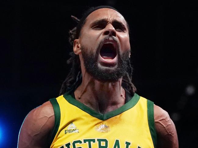 Patty Mills of Australia celebrates after making a basket in the final minutes during match 2 of the Pre-FIBA World Cup series between Australia and the USA  at Marvel Stadium in Melbourne, Saturday, August 24, 2019.  (AAP Image/Scott Barbour) NO ARCHIVING, EDITORIAL USE ONLY