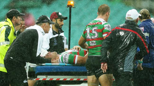 Sam Burgess was stretchered off the field on a medicab. Picture: Brett Costello