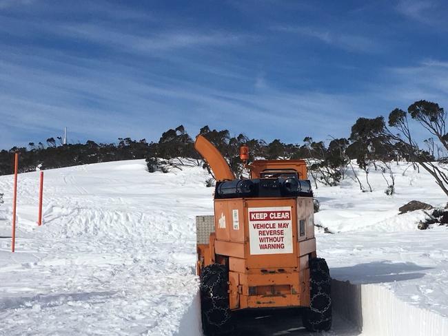 Pictures: Kunanyi snow so deep workers struggle to find road