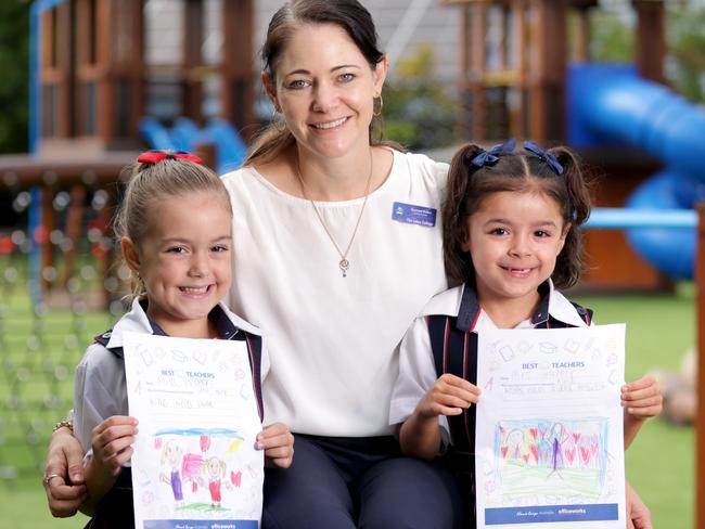HOLDING FOR BEST TEACHER CAMPAIGN -  Suzanne Walker teachers year 1W, with her students L to R, Isla Kurzydlo 6yrs, and Ivie Rogers 6yrs, for the Best Teachers campaign, the year 1 primary students writing letters to their teacher, Lakes College, College St, North Lakes - on Thursday 15th May 2025 - Photo Steve Pohlner