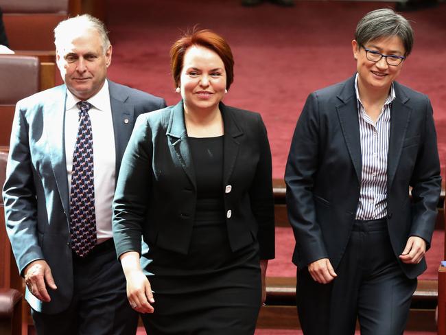 Kitching flanked by Senators Don Farrell and Penny Wong as she is sworn in. Picture: Ray Strange.