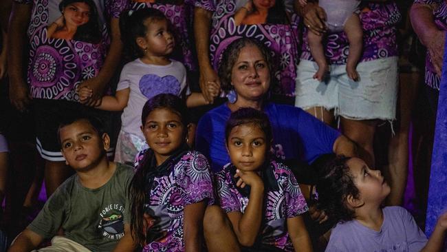 Tara May, the mother of 19-year-old Kailah May who drowned as a result of an epileptic fit in 2022 was surrounded by loved ones under the purple lights of the Darwin Convention Centre on Tuesday March 27 for Epilepsy Awareness Day. Picture: Zizi Averill