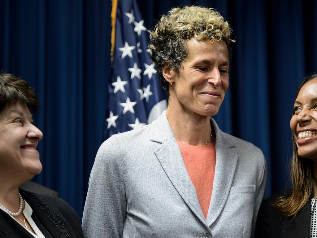 People smile during a press conference with Andrea Constand (C), after the sentencing of the comedian.