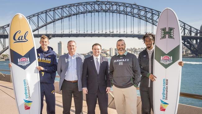 Davis Webb, coach Sonny Dykes, NSW MP Stuart Ayres, coach Nick Rolovich and Marcus Kemp posing for a photo in Sydney.