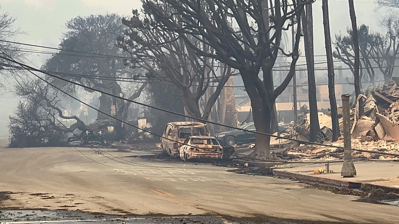 Cars burned out on Sunset Boulevard. (Photo by Bellocqimages/Bauer-Griffin/GC Images)