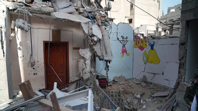 Images of Mickey Mouse and Snow White overlook the devastation. Picture: Sharon ARONOWICZ / AFP