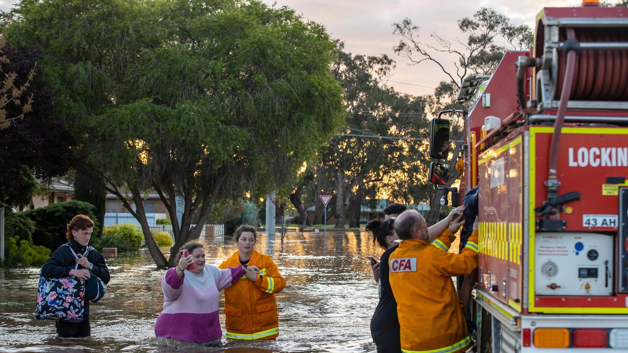 A Rochester family is rescued after their home was waist-deep in water. Picture: Jason Edwards