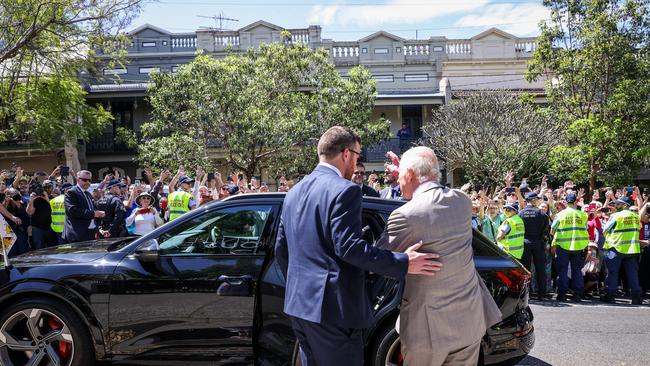 King Charles III waves to the waiting public after a visit to the National Centre of Indigenous Excellence. Picture: Getty